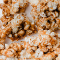 Caramel popcorn on a white surface