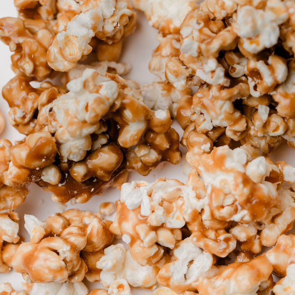 Caramel popcorn on a white surface