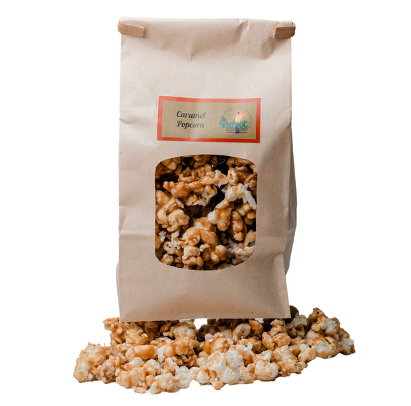 Bag of caramel popcorn with a clear window showing the popcorn inside, on a white background.