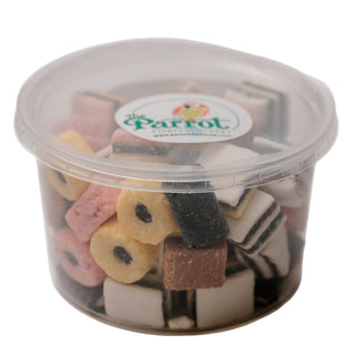Clear container with dog treats labeled 'Parrot' on a white background