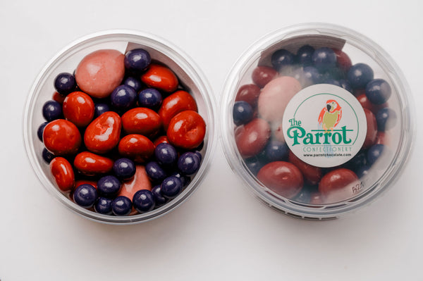 Two containers of colorful candies with a visible brand label on a white background