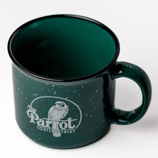 Green mug with a logo on a white background