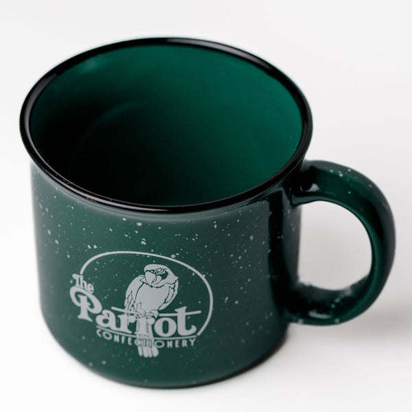 Green mug with a logo on a white background