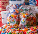 Colorful candy assortment with Parrot Confectionery packaging on a festive background.