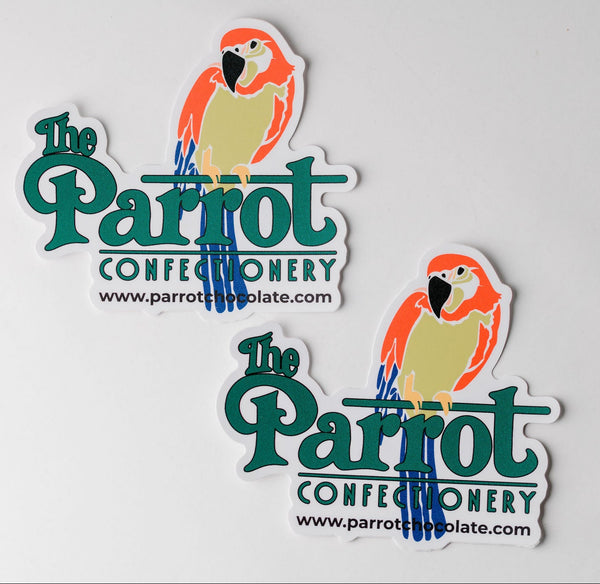 Two stickers of 'The Parrot Confectionery' with parrot illustrations on a white background.