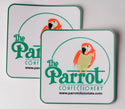 Two coasters with 'The Parrot Confectionery' logo on a light gray background